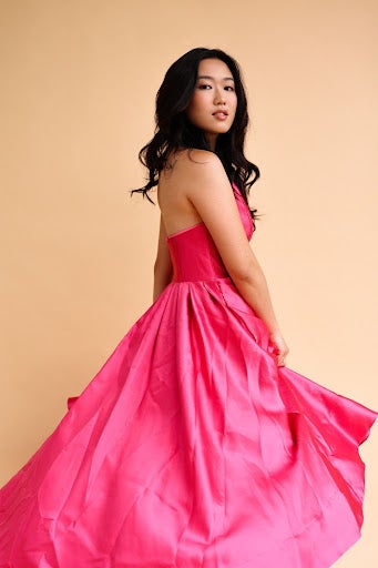 model photo of a woman in a pink dress