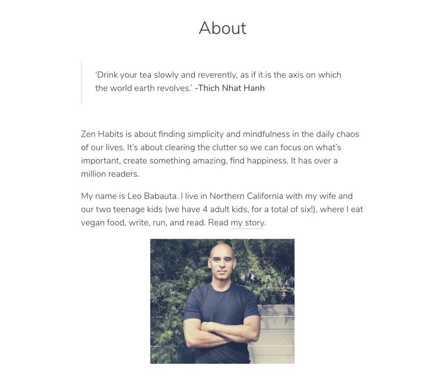 A very simple website with several paragraphs of text and a photo of man in a blue t-shirt standing in front of plants. He's got a shaved head and is in shape.