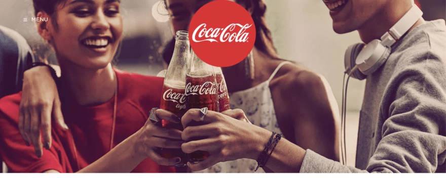 Coca-Cola website with image of three people cheering Coca-Cola bottles