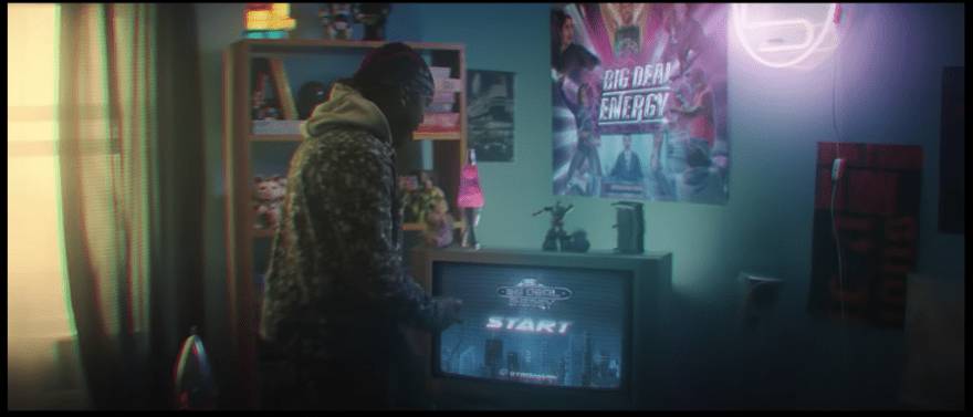 Influencer KSI in a room playing a video game in a still of GymShark's Black Friday video