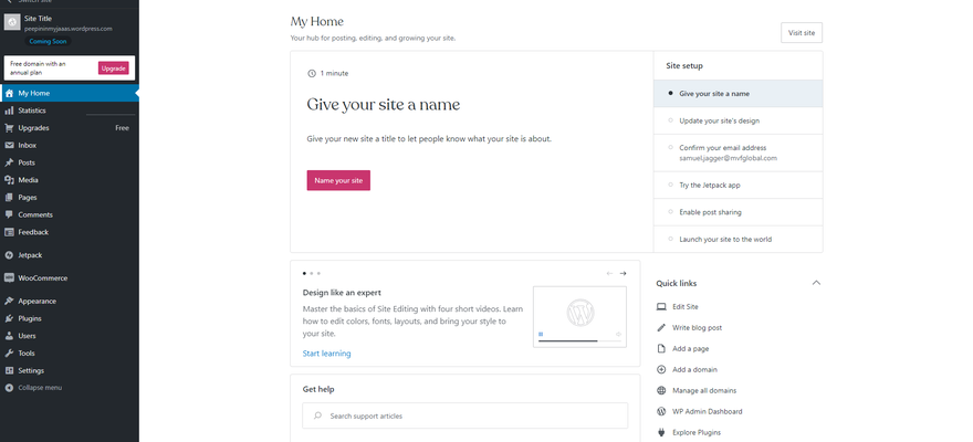 The dashboard of WordPress.com, with charcoal side menu and a pink button